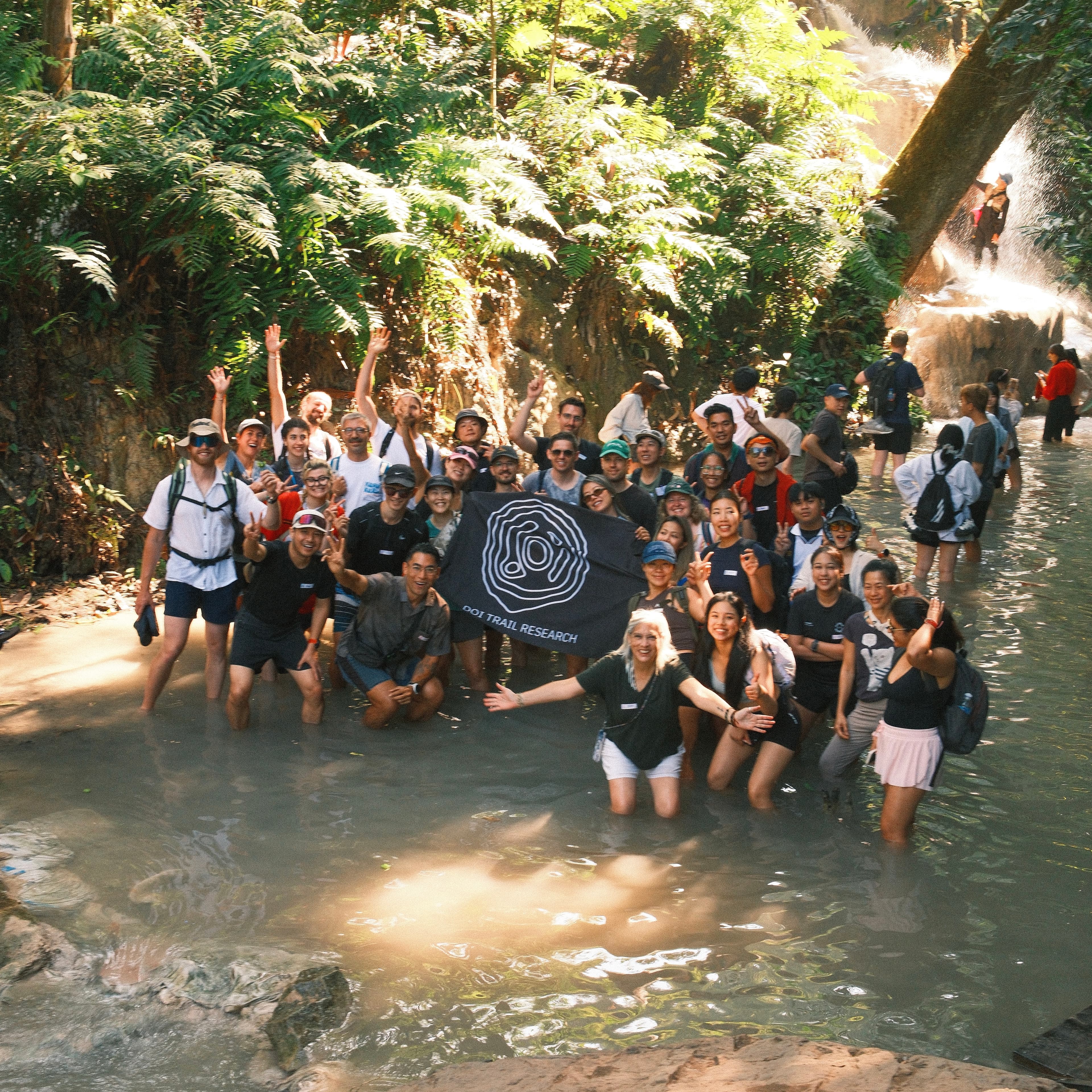 Doi Trail Research club at a waterfall in Chiang Mai